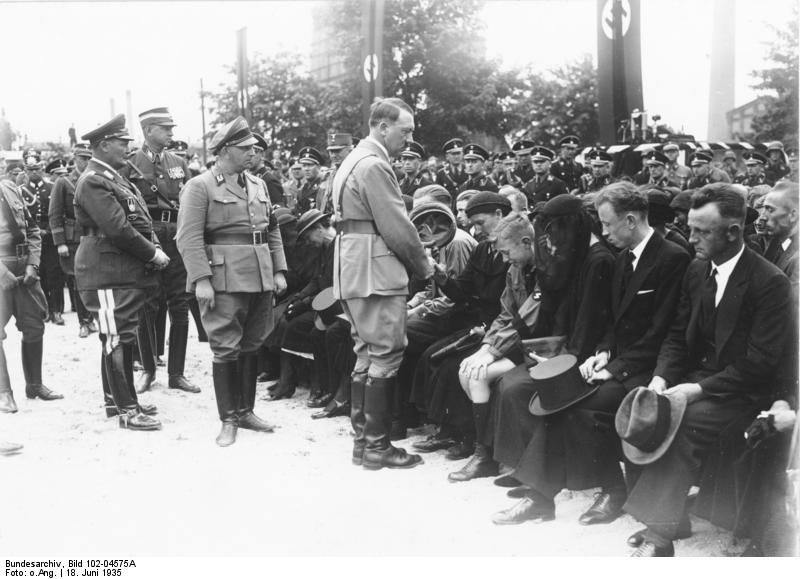 Adolf Hitler at the funeral ceremony for the 60 workers who died in the explosion of the factory in Reinsdorf